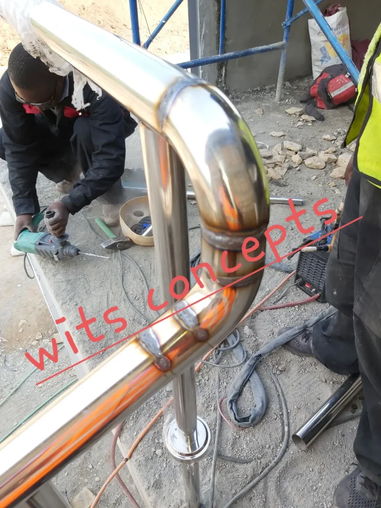 Stainless Steel Railings - stainless steel and glass railing installation 4 by Wits Concepts